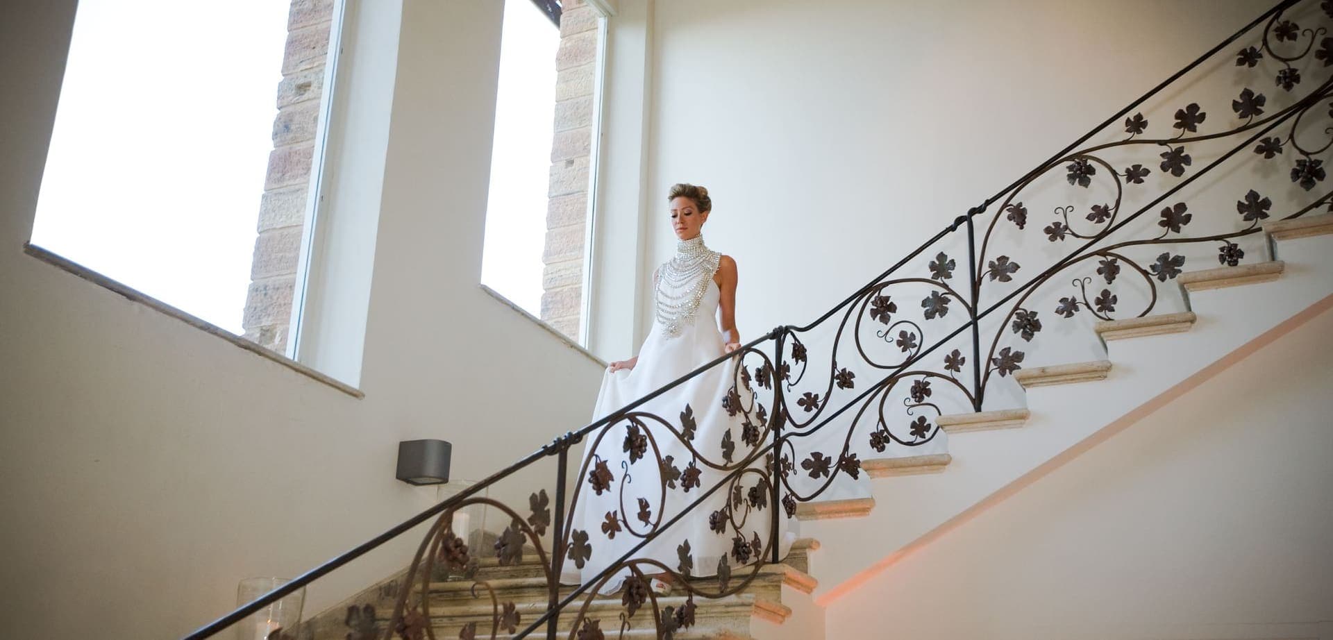 Wedding cinematography — bride on a staircase